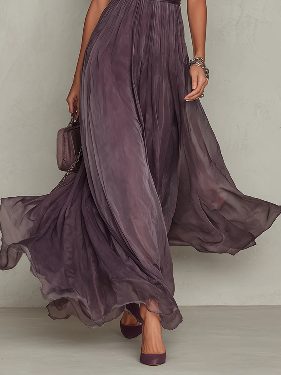 Vestido largo morado con falda acampanada semitransparente y cinturilla fruncida