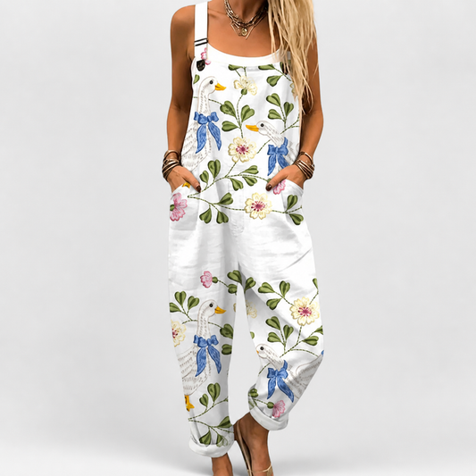 Mono tipo jardineras de mujer sin mangas con estampado floral y aves, tela blanca
