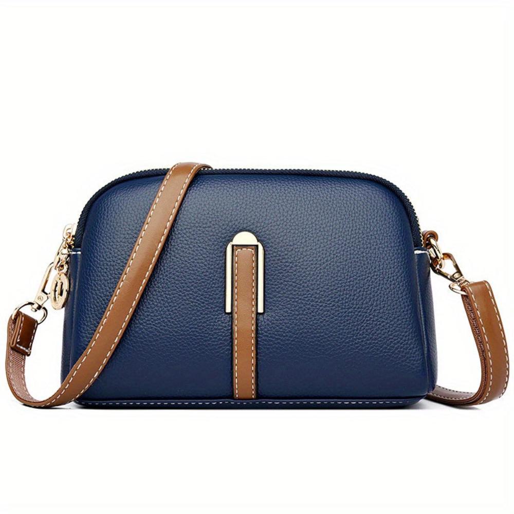 Bolso bandolera textura lichi azul oscuro, cierre cremallera y bandolera ajustable