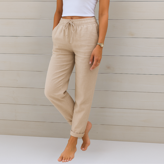 Pantalones casuales color beige claro con cintura elástica y cordón, puños en el bajo