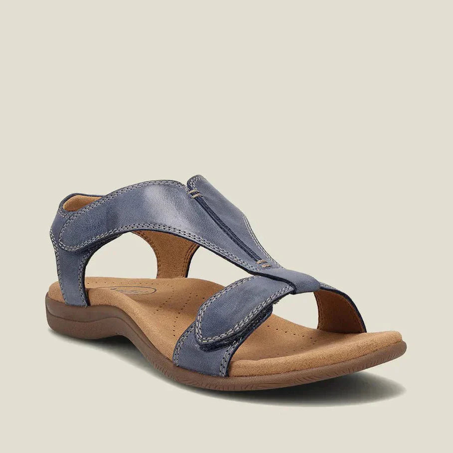 Sandalias ergonómicas azules de ante, con tira ajustable y suela amortiguada.