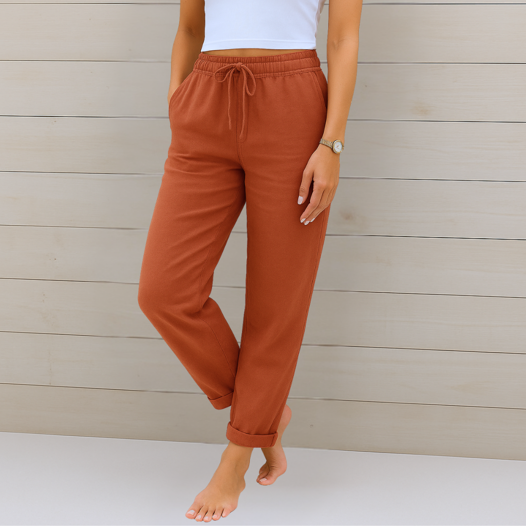 Pantalones casuales color teja con cintura elástica y cordón, puños en el bajo