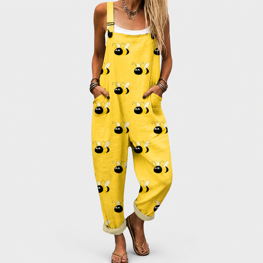 Peto con tirantes amarillo mostaza y estampado de caritas; bolsillo y botones delanteros