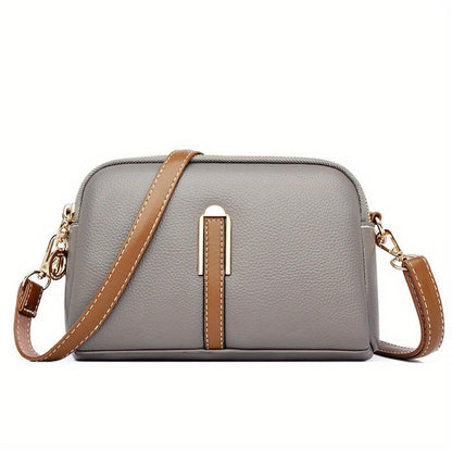 Bolso bandolera textura lichi gris, cierre cremallera y bandolera de cuero