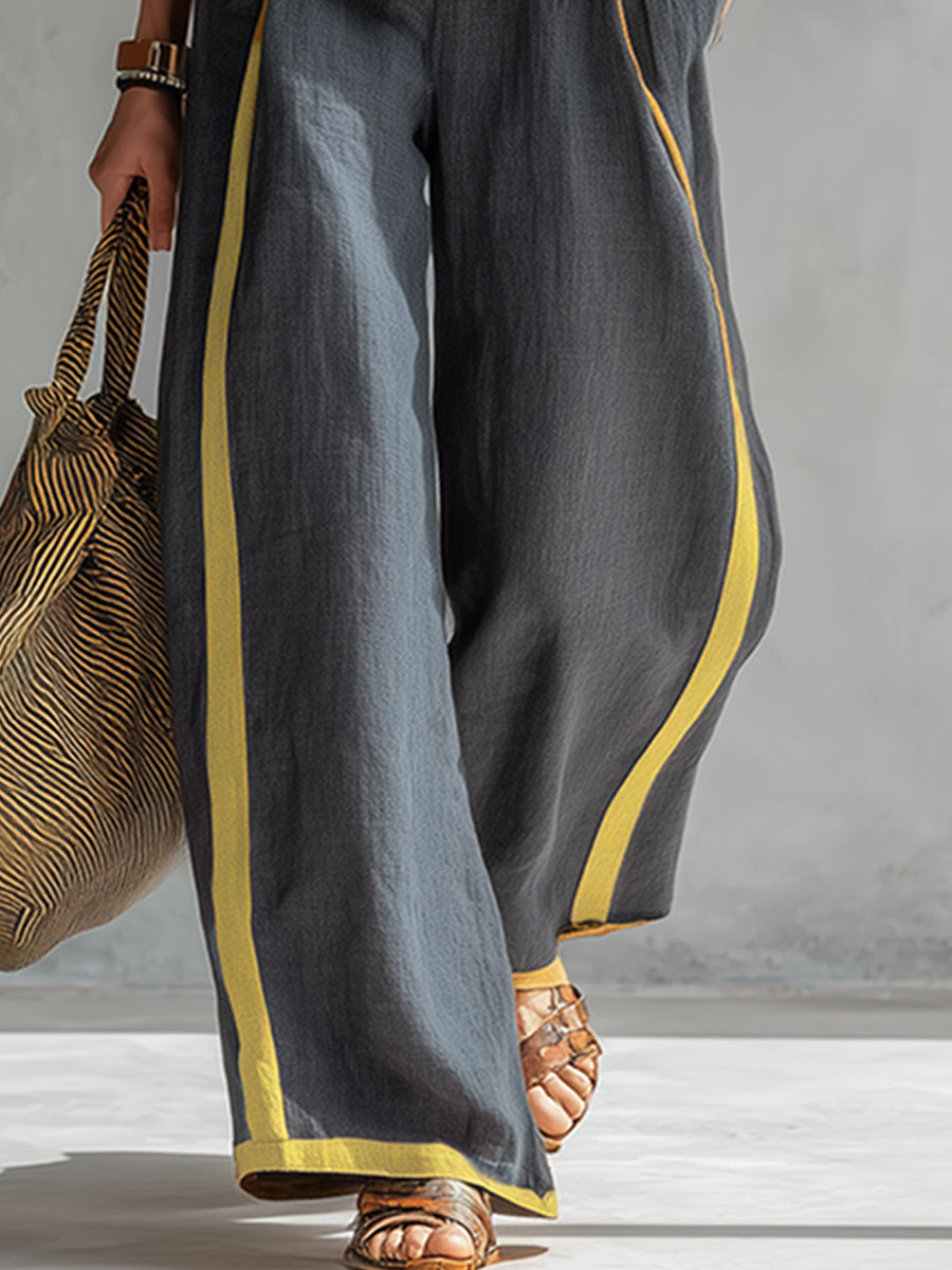 Pantalón ancho de algodón y lino gris oscuro con dobladillo y ribete amarillo