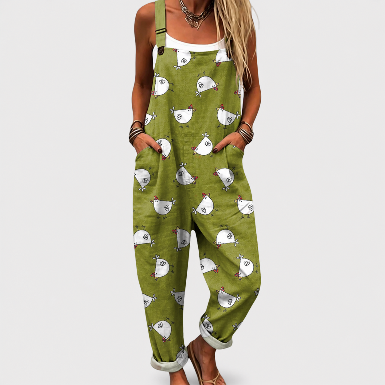 Salopette de mujer verde con tirantes y estampado de aves blancas, peto frontal