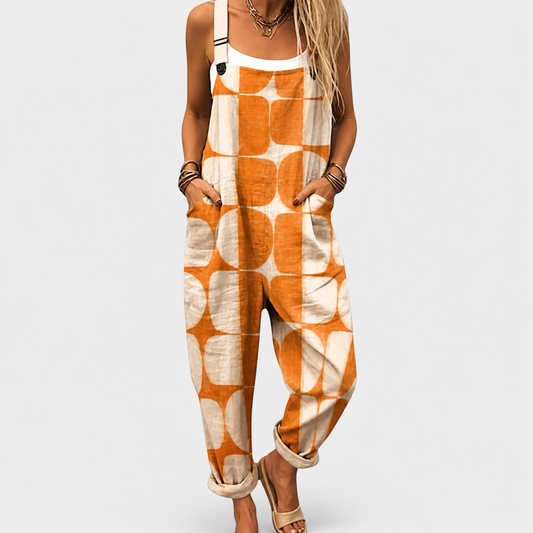 Salopete de mujer estampada naranja y blanca, tirantes ajustables y peto frontal