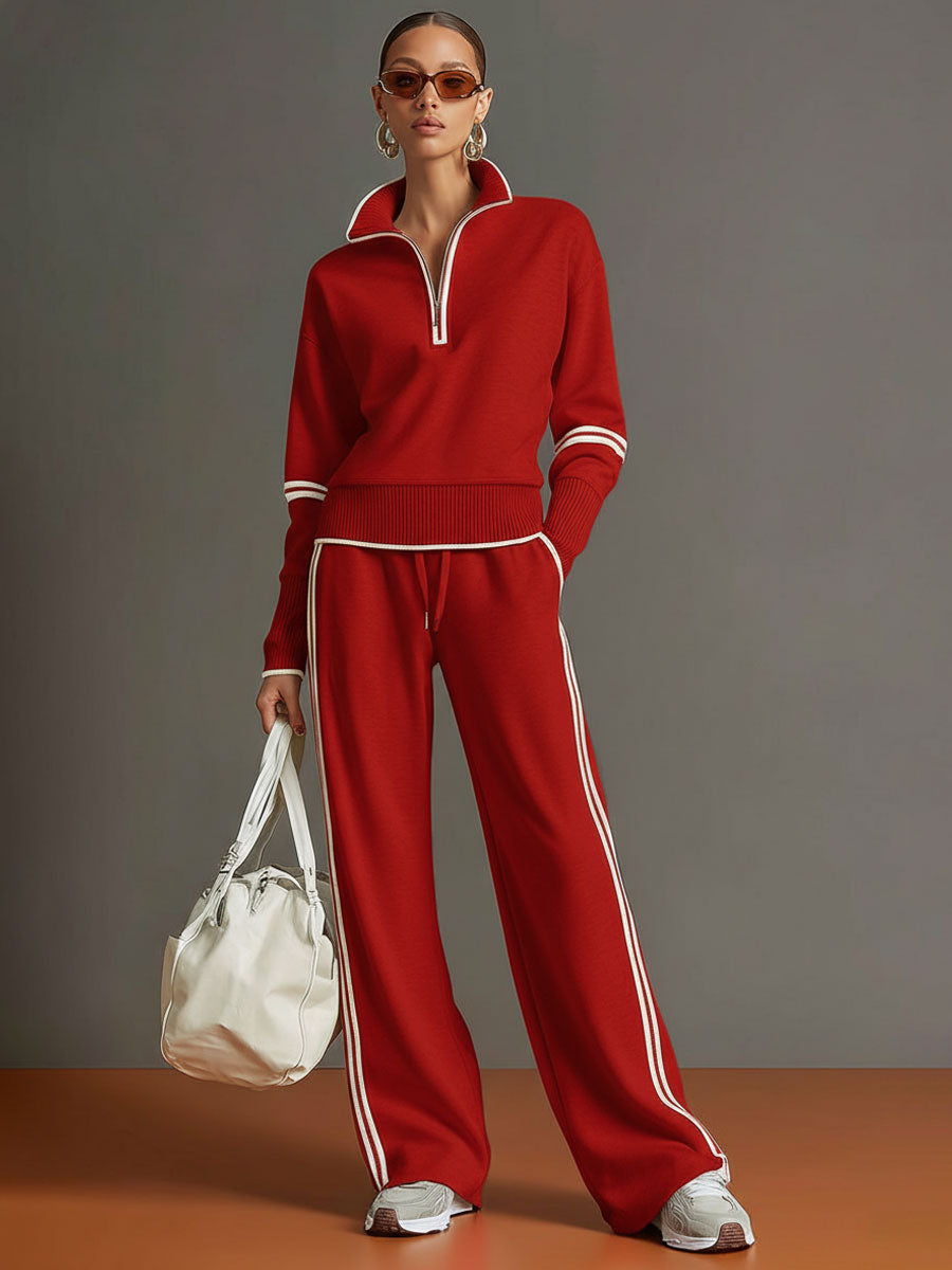 Sudadera roja con media cremallera y pantalón ancho a rayas blancas, conjunto a juego