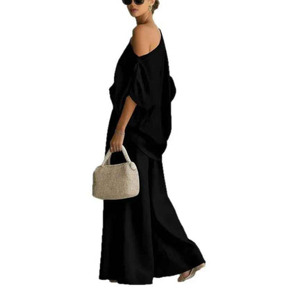 Conjunto de lino negro: blusa caída asimétrica y pantalón ancho con cintura fruncida