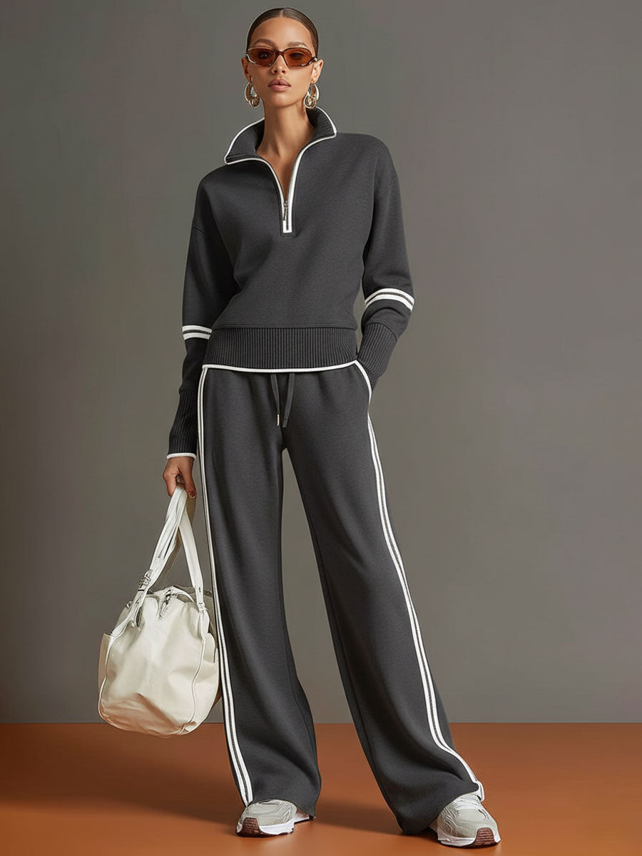 Conjunto deportivo negro con sudadera de media cremallera y pantalón ancho con rayas blancas