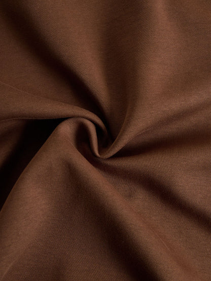 Tela de sudadera marrón lisa, textura tejida
