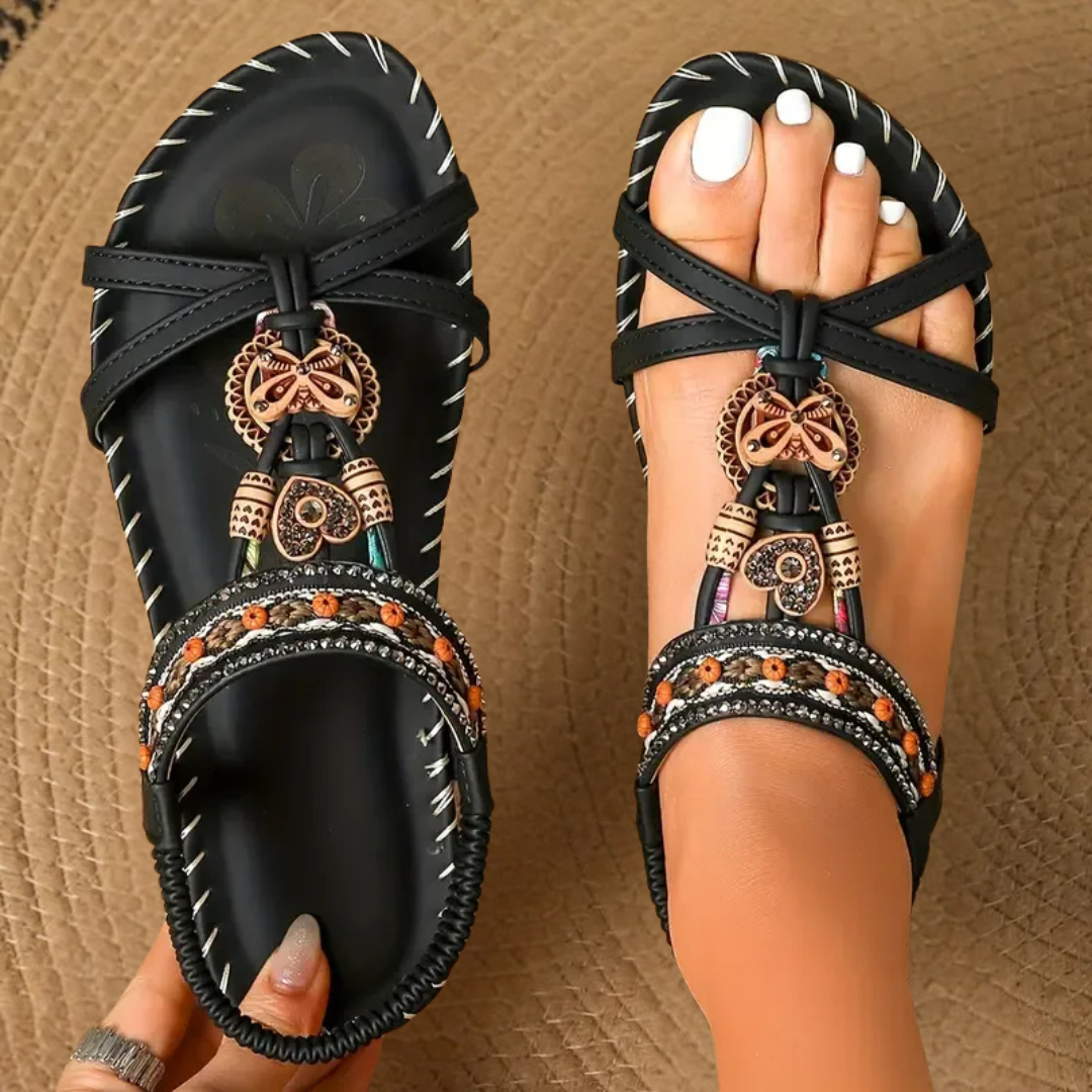 Sandalias ortopédicas negras con pulsera elástica y adorno colgante en el empeine