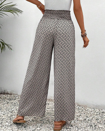Pantalones de pierna ancha grises con estampado repetido y caída suelta