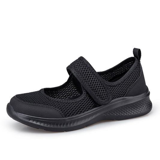 Zapatilla Nicole negra con cierre de velcro y suela con relieve