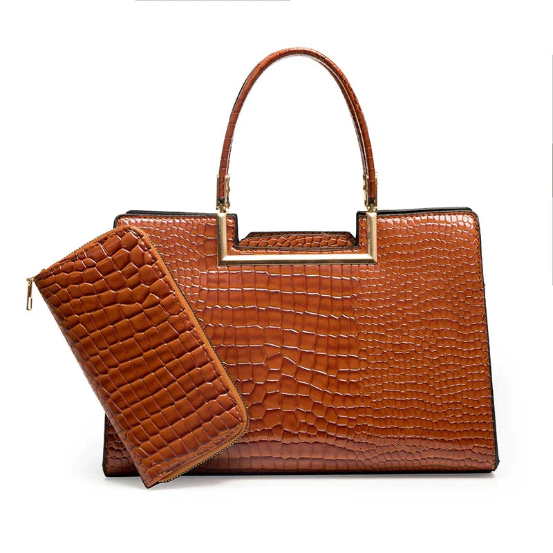 Juego de bolso de cuero marrón con cartera a juego, asas superiores y textura tipo cocodrilo