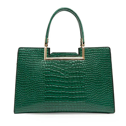 Bolso de cuero verde con asa superior y acabado tipo cocodrilo