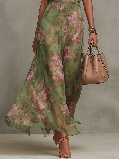 Vestido largo verde floral sin mangas, falda amplia y vuelo con caída