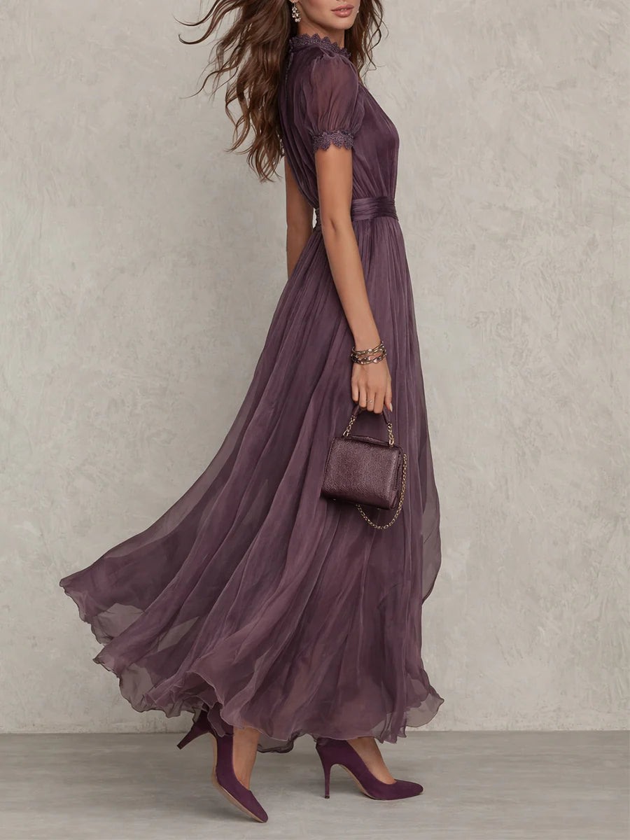 Vestido largo morado con escote tipo llave y mangas abullonadas, falda con vuelo