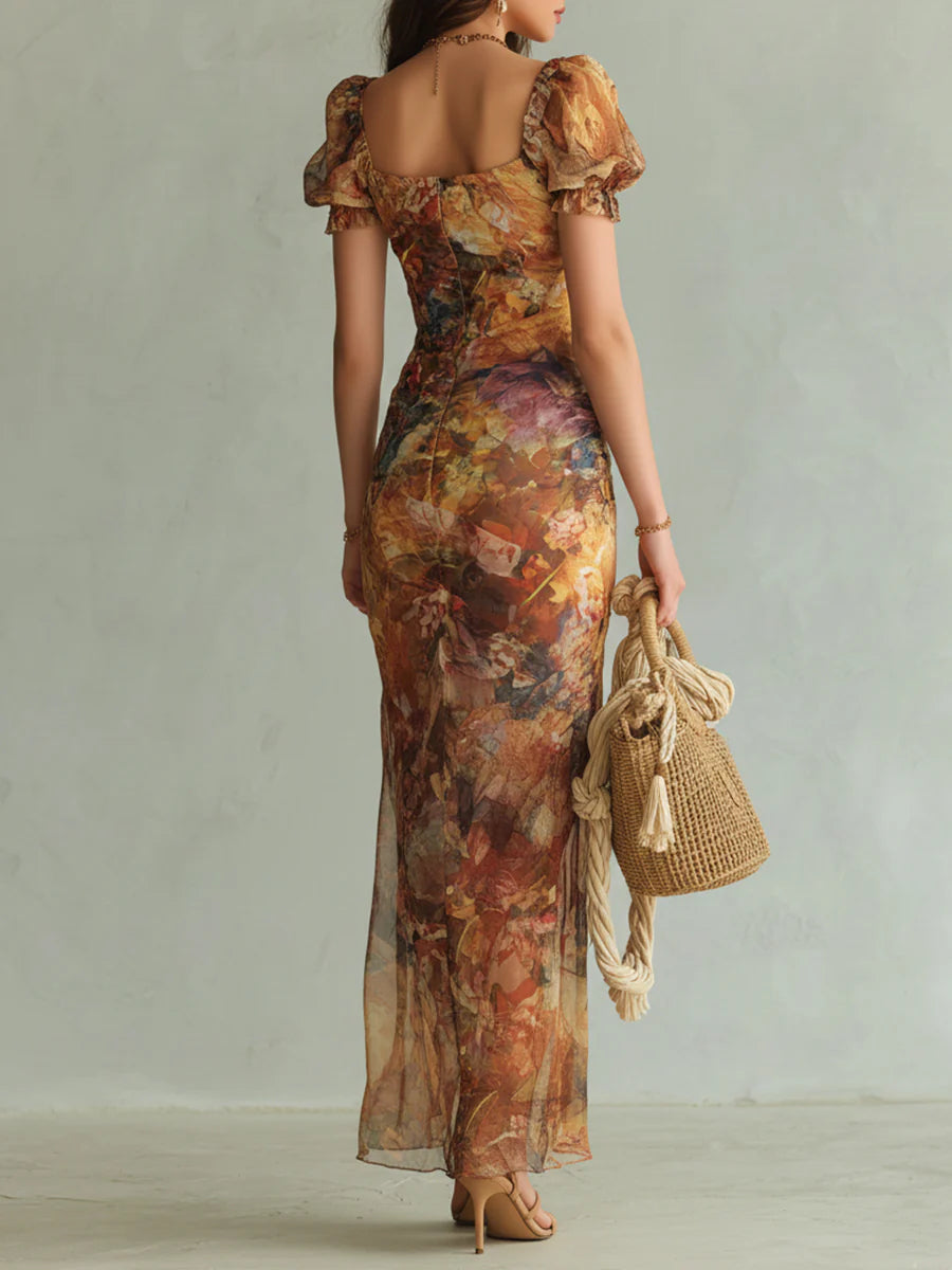 Vestido largo de gasa multicolor con mangas abullonadas y falda con abertura