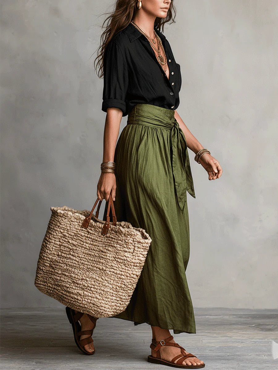 Conjunto de dos piezas: camisa negra abotonada y falda midi verde oliva con lazo
