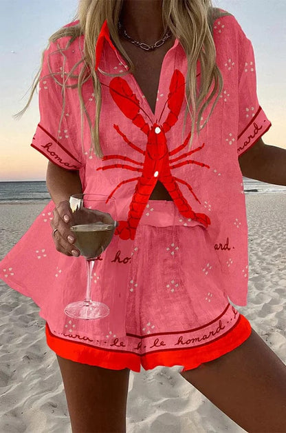 Conjunto Andrea rosa con blusa abotonada de manga corta y estampado rojo