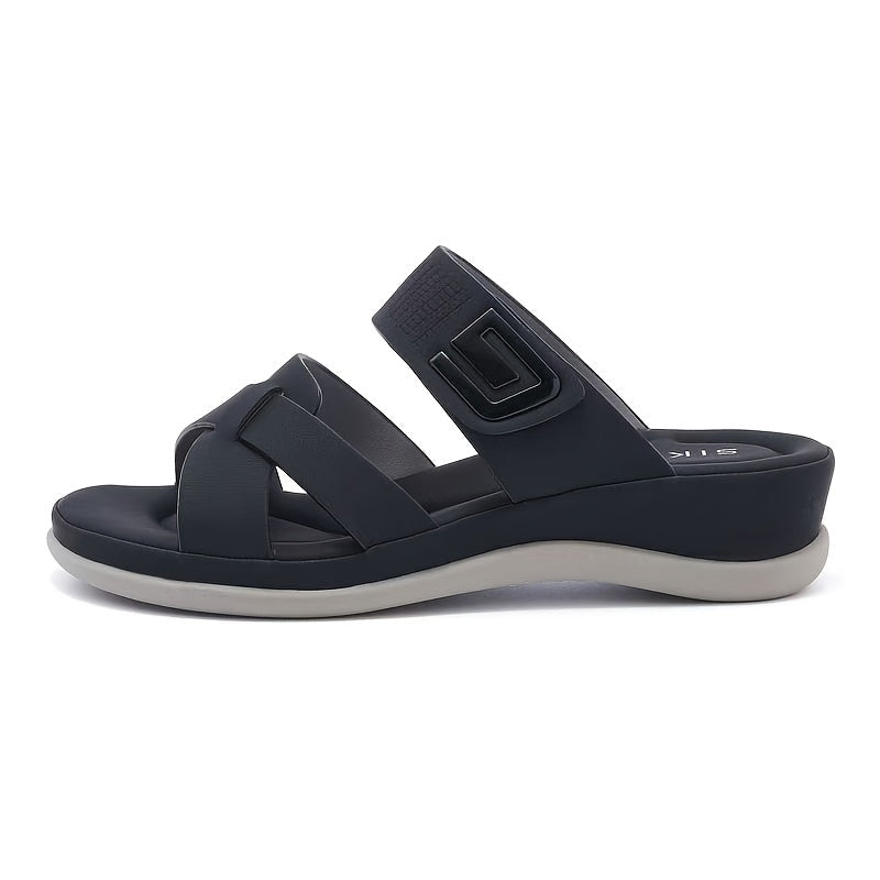 Sandalias Iris azul marino, perfil lateral con emblema en la correa del talón