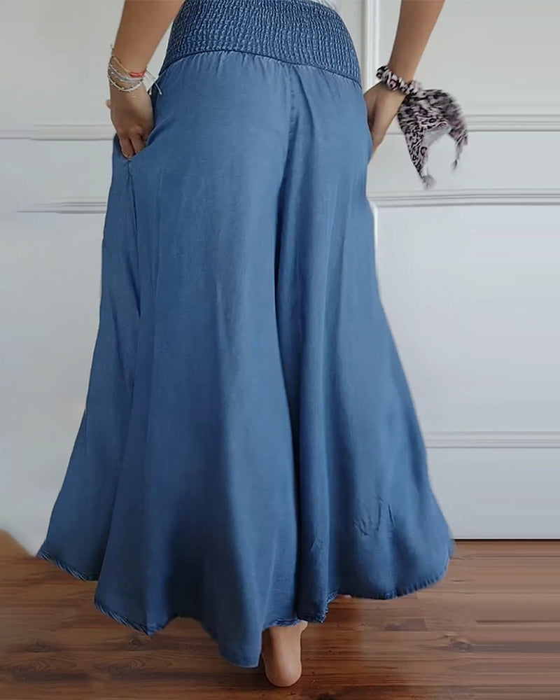 Pantalones de cintura alta con elástico azul, pierna amplia y tejido con caída