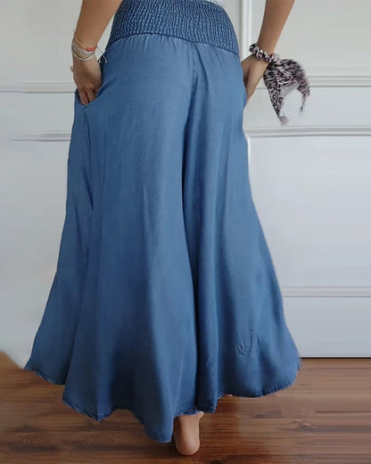 Pantalones de cintura alta con elástico azul, pierna amplia y tejido con caída