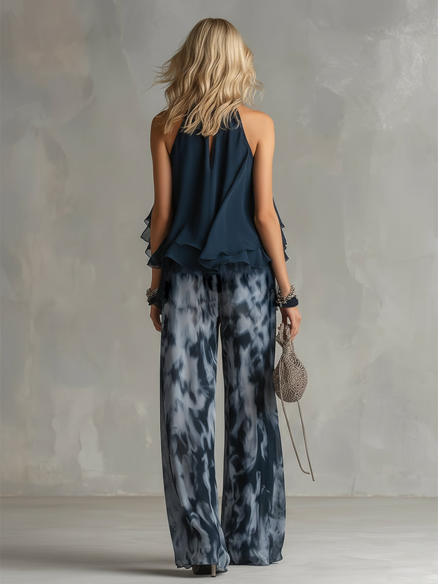 Conjunto azul marino visto por detrás: blusa sin mangas de cuello alto y pantalón