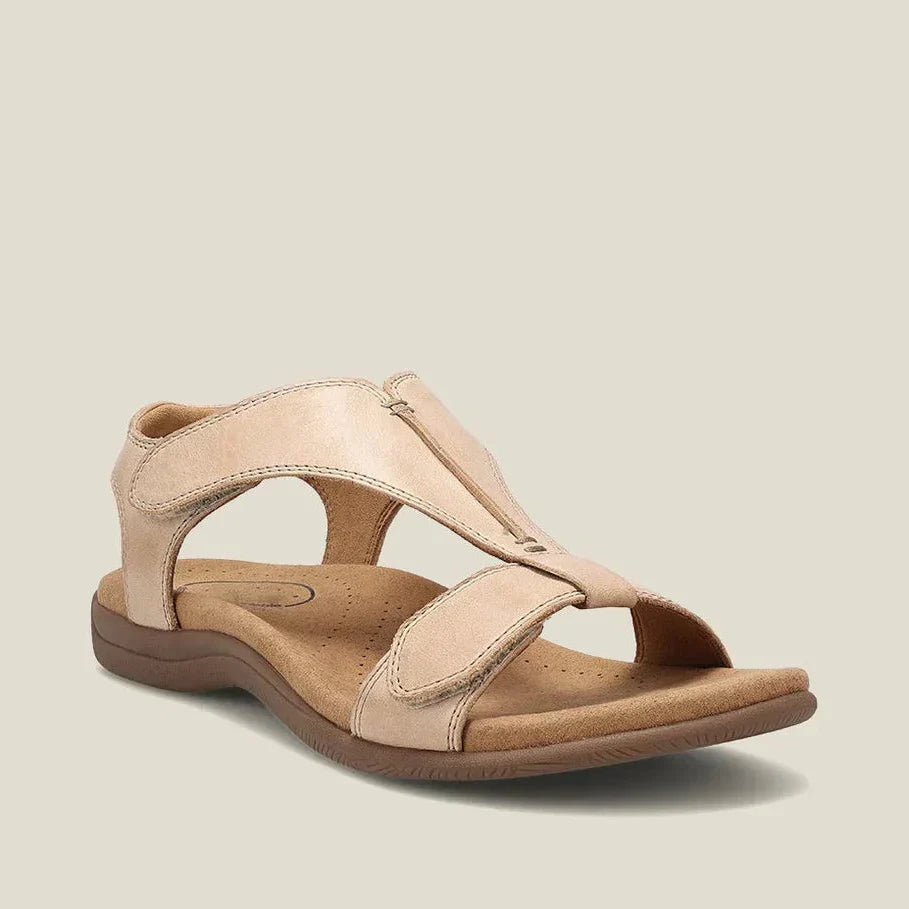 Sandalia ortopédica beige vista lateral, con doble tira y suela acolchada