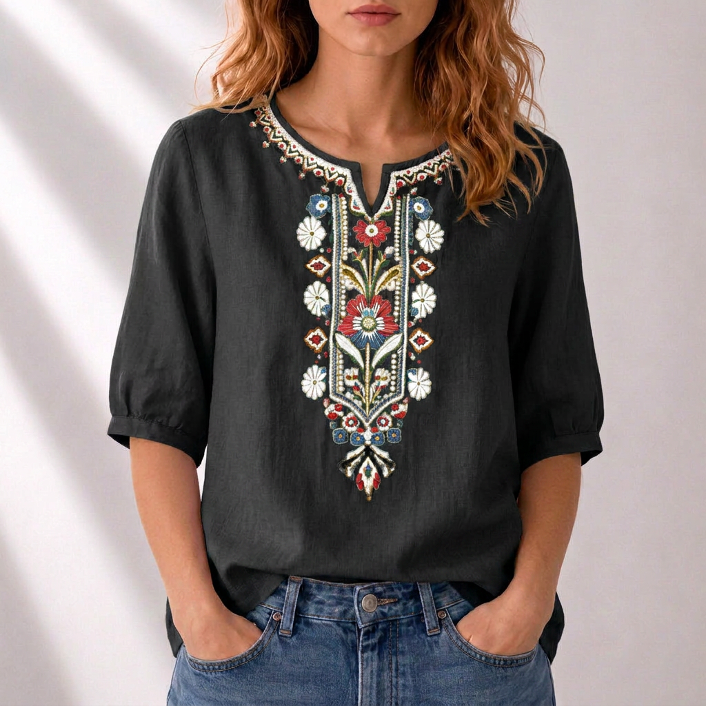 Blusa de lino negra con bordado floral multicolor al centro y tapeta con abertura
