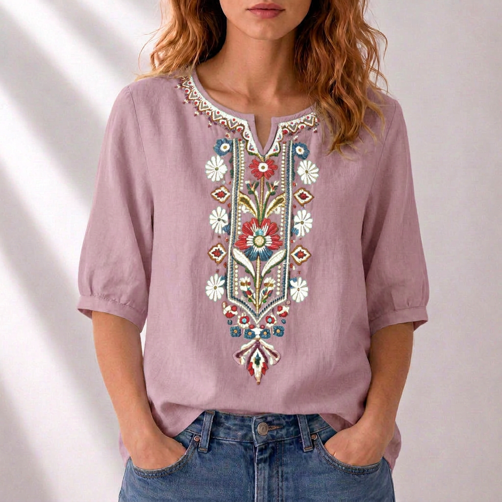 Blusa de lino lila con bordado floral multicolor al centro y cuello con tapeta