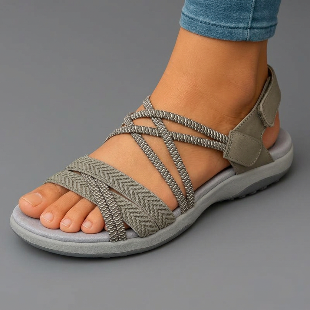 Sandalia ortopédica beige de tiras elásticas con velcro en el talón y suela gris