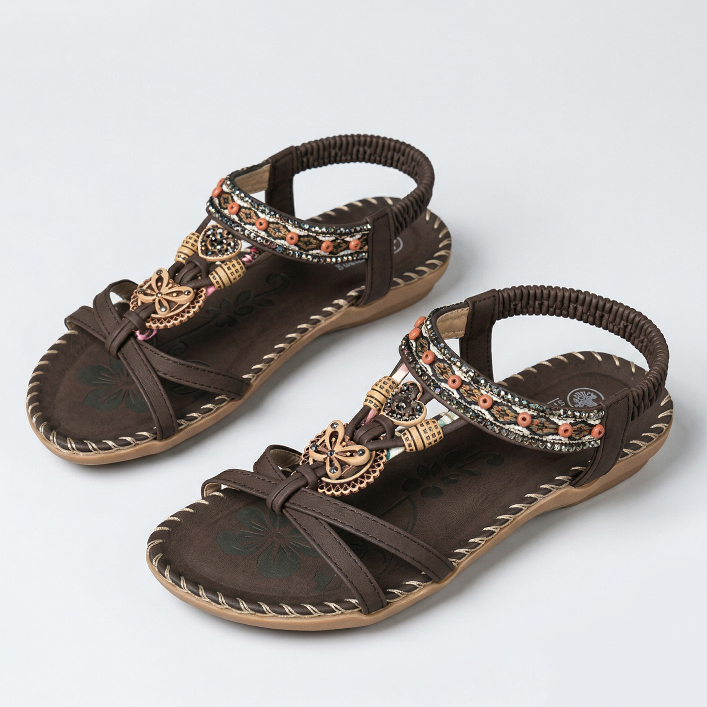 Sandalias ortopédicas estilo Ibiza marrones con tiras cruzadas y bordado decorativo