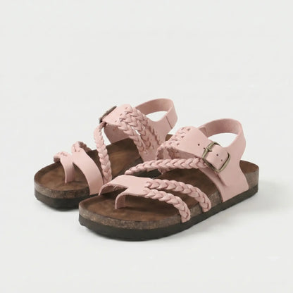 Sandalias ortopédicas rosa claro con correas trenzadas y hebilla, suela de goma