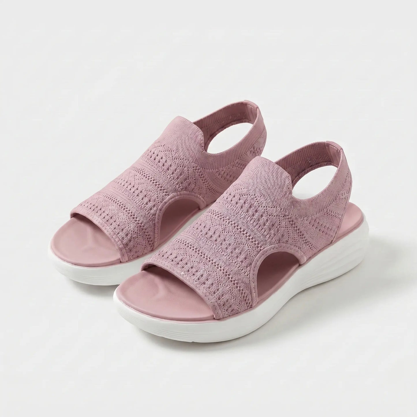 Sandalias ortopédicas de tejido rosa, punta abierta y suela blanca acolchada