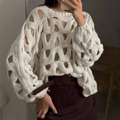 Jersey calado de punto blanco oversize, cuello redondo y mangas abullonadas con huecos