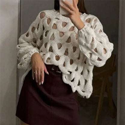 Jersey calado de punto blanco con calado ovalado y mangas abullonadas, cuello redondo