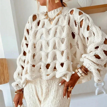 Jersey calado de punto blanco, cuello redondo y manga larga con tramas agujereadas