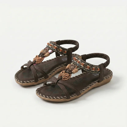 Sandalias ortopédicas marrones con tiras cruzadas, pulsera elástica y suela acolchada