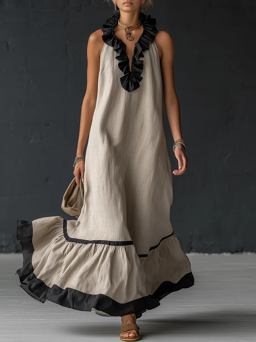 Vestido largo sin mangas crema con volantes en el escote y falda con borde negro