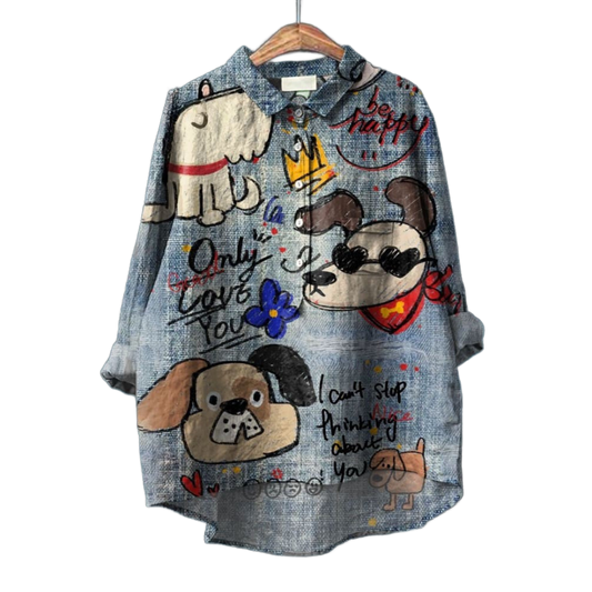 Blusa de lino azul con estampado de dibujos y lazo en el cuello