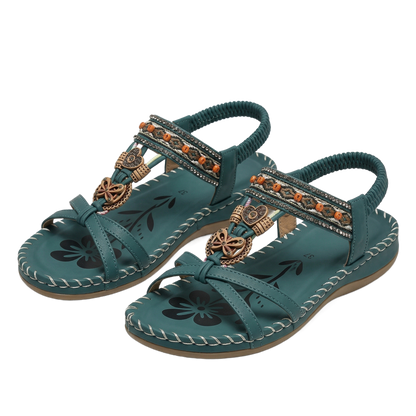 Sandalias ortopédicas turquesa con tiras trenzadas, pedrería y estampado floral