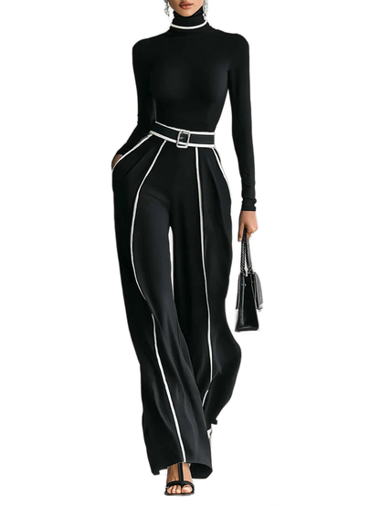 Conjunto negro con cuello alto, cinturón con hebilla y líneas blancas en pantalón ancho
